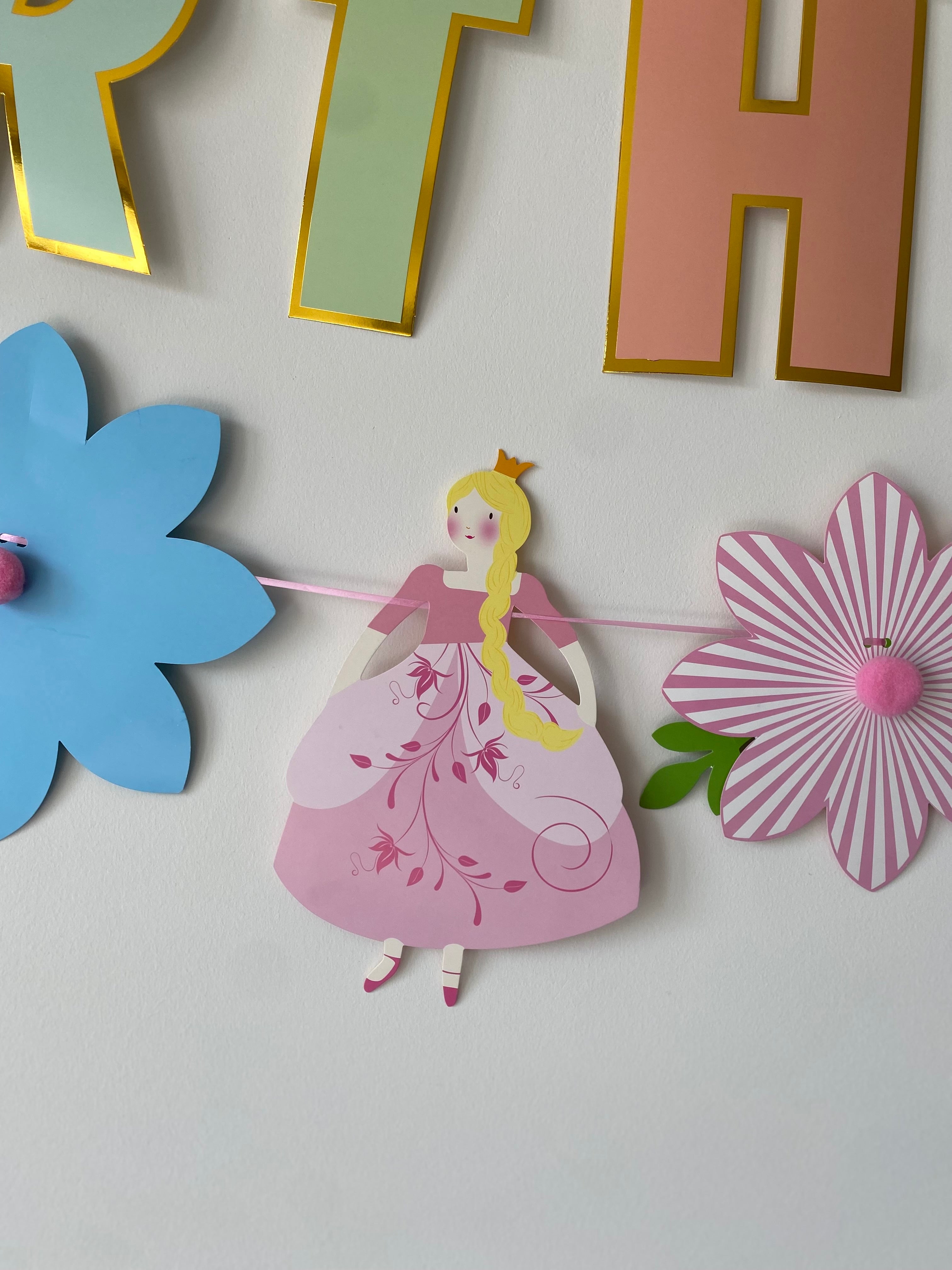 Prinsessenslinger met bloemen en pompons
