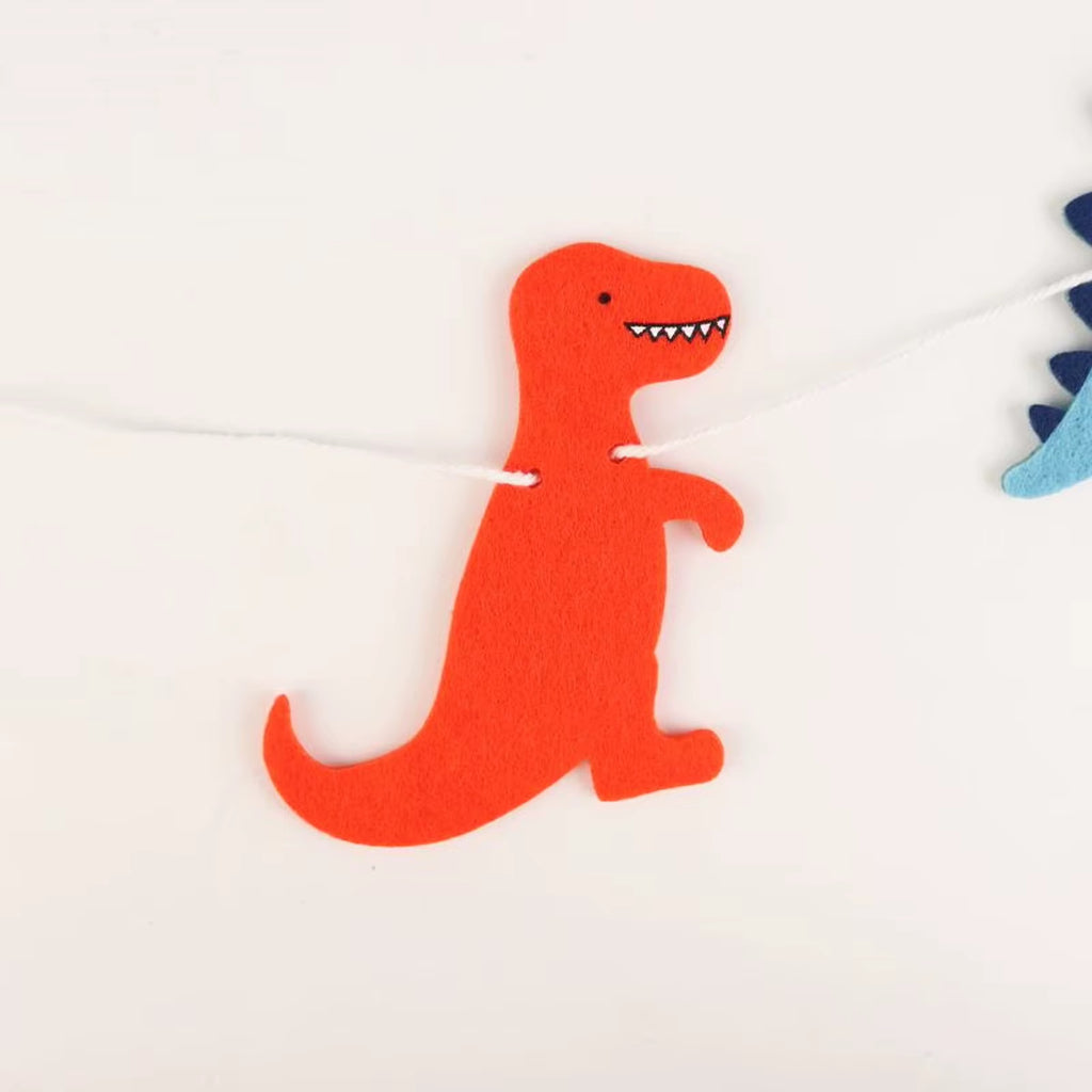 Vilten dinosaurus slinger